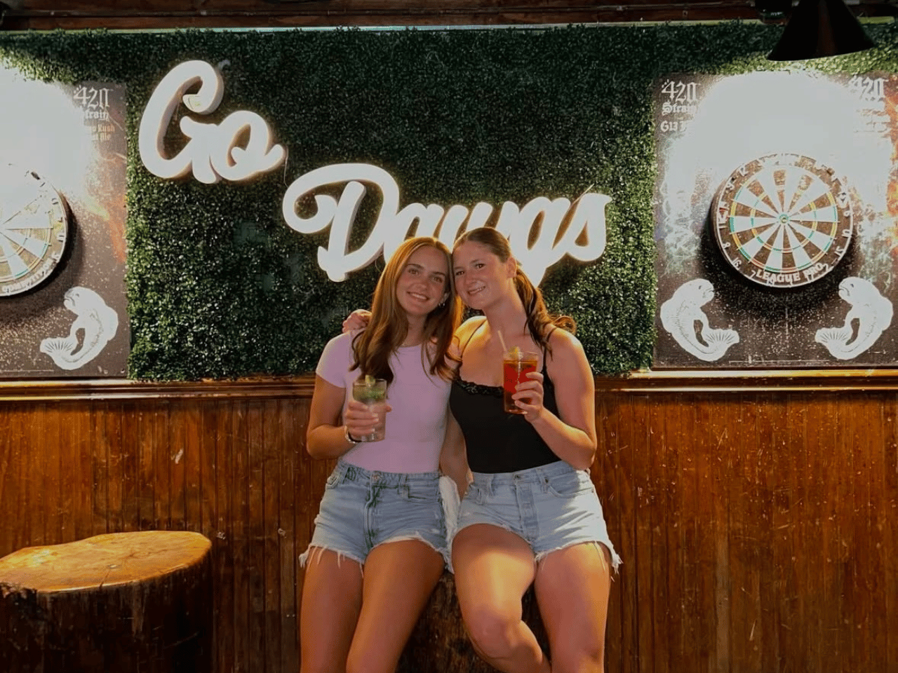 Two girls have drinks at the Silver Dollar Bar in Athens.